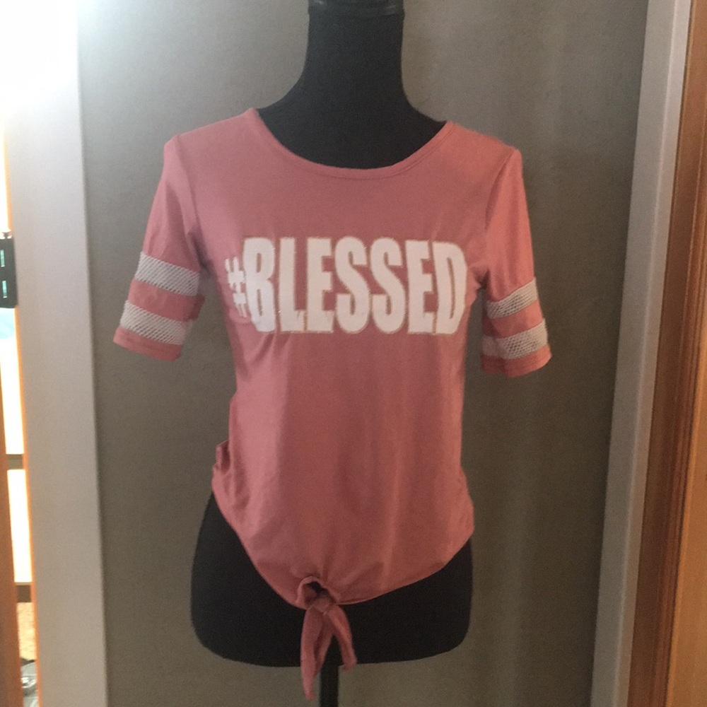 Pink t-shirt says #Blessed